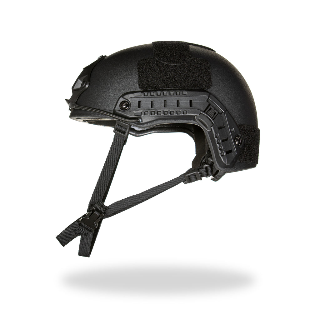 Black tactical helmet with chin strap on a white background